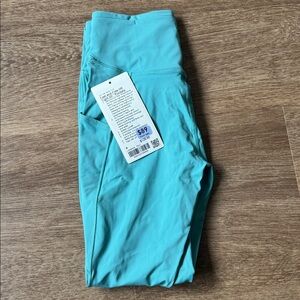 Fast and Free High-Rise Tight 25" 5 Pocket in Tidal Teal NWT